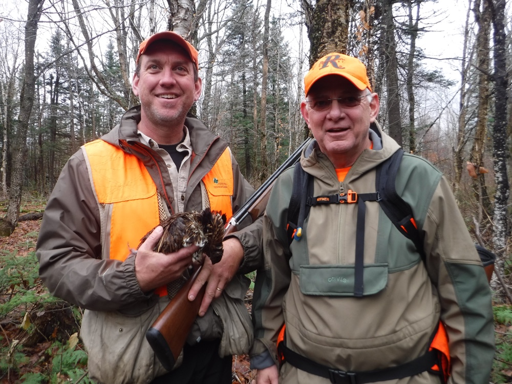 Jon with one of his grouse, assisted by Rick